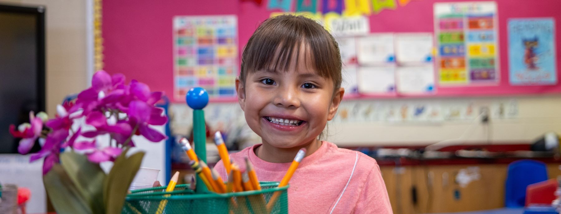 Happy student in classroom.